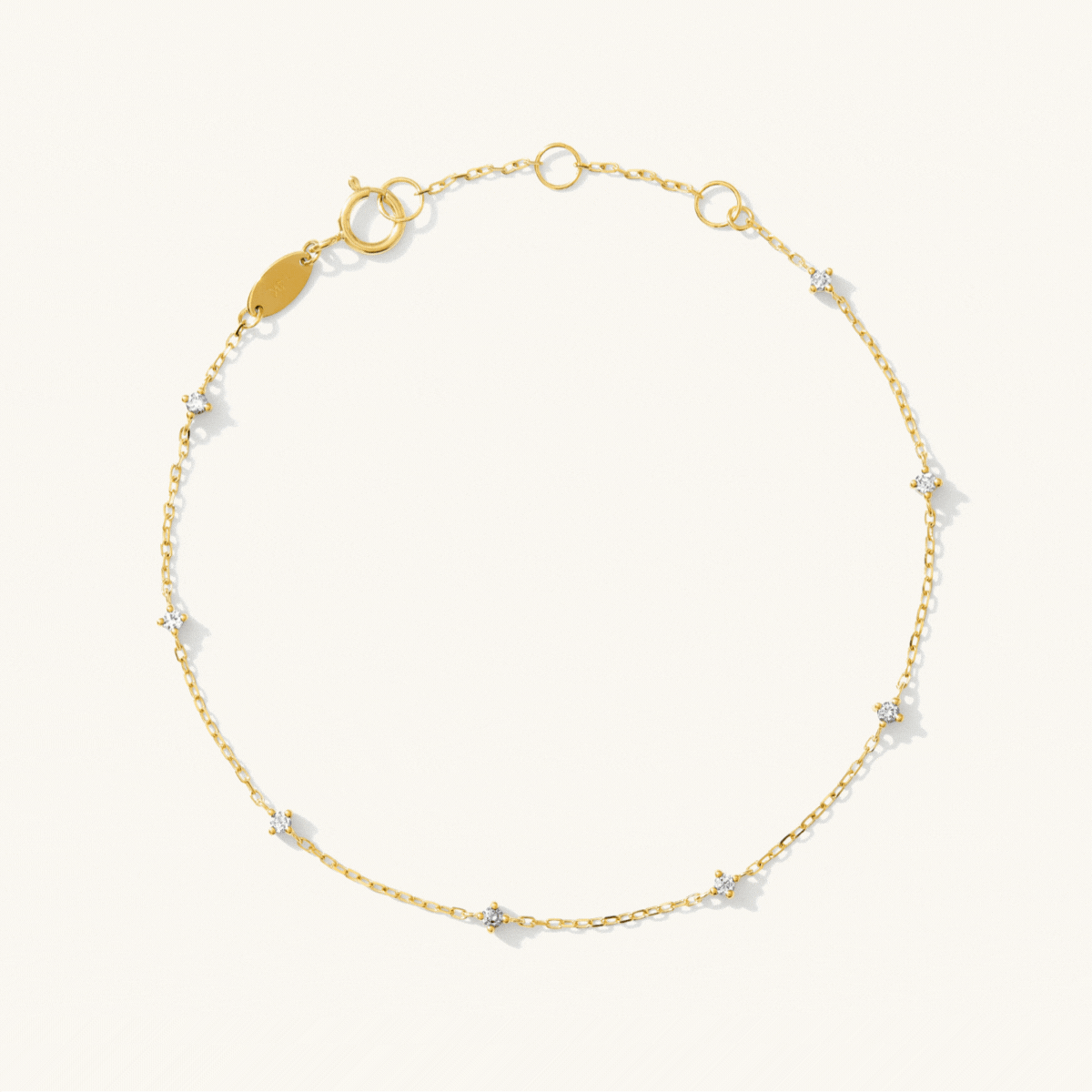 Gold bracelet with small diamonds on a white background: Dainty Diamond Station Bracelet - Reversible | Simple & Dainty Jewelry 
