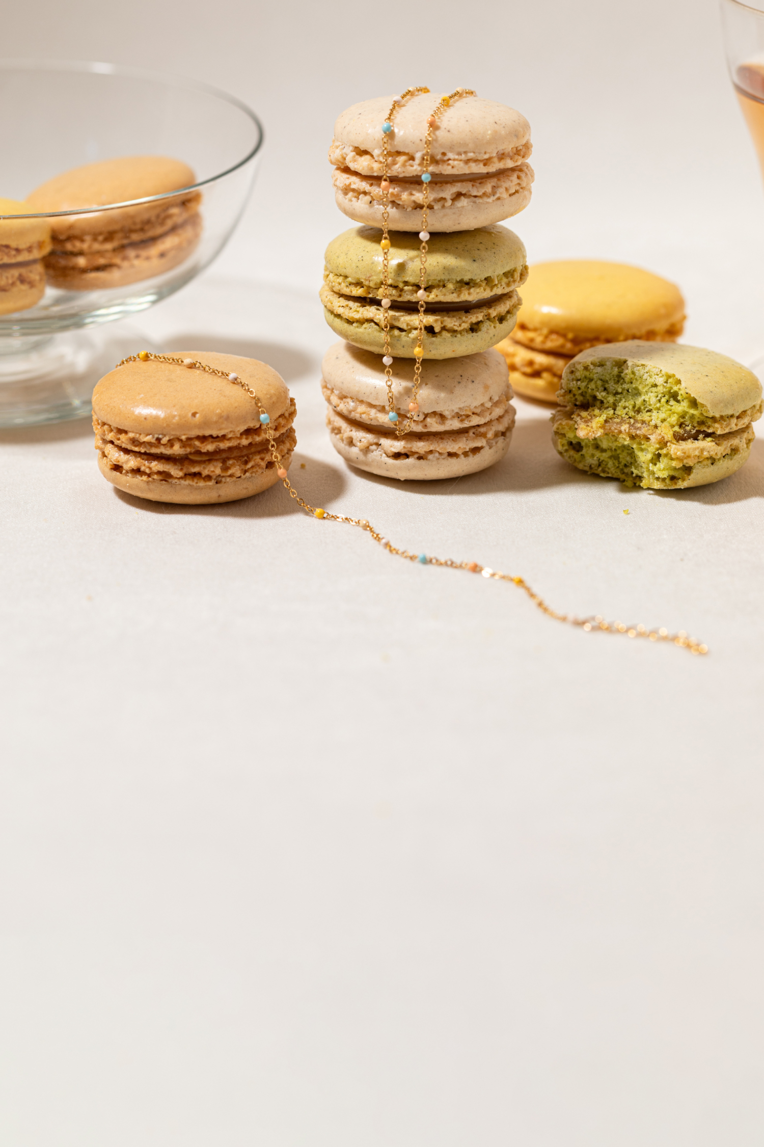 Sliced figs on a decorative plate with flowers and Dainty Enamel Pastel Chain and jewelry on a light background