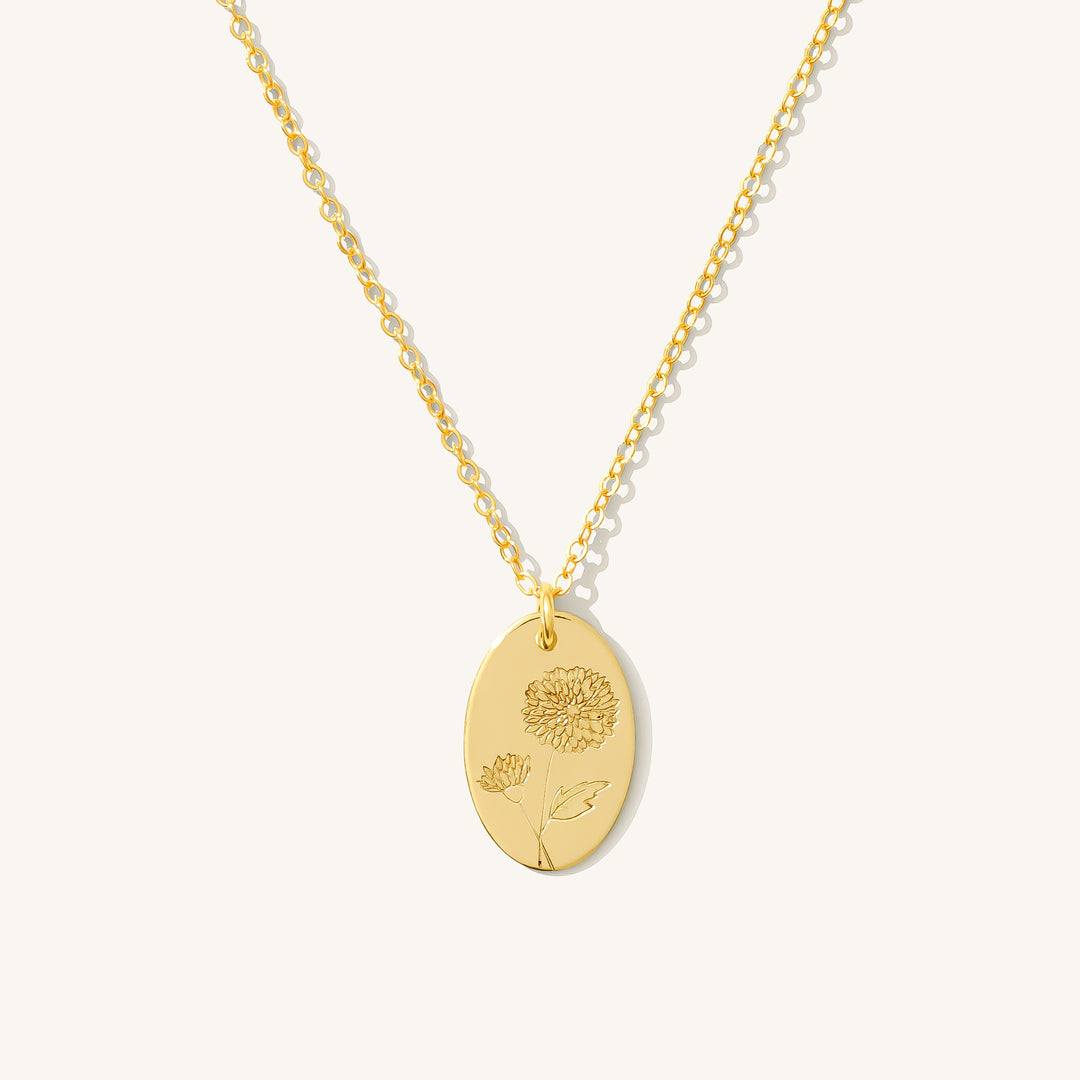 November Birthflower Necklace in gold-filled, featuring a stamped chrysanthemum flower on an oval disc pendant.