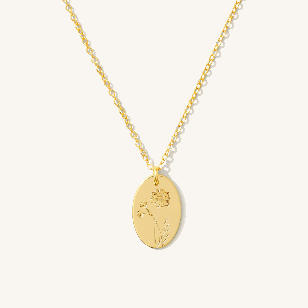 October Birth Flower Necklace in gold filled featuring a stamped cosmos flower on an oval disc pendant.