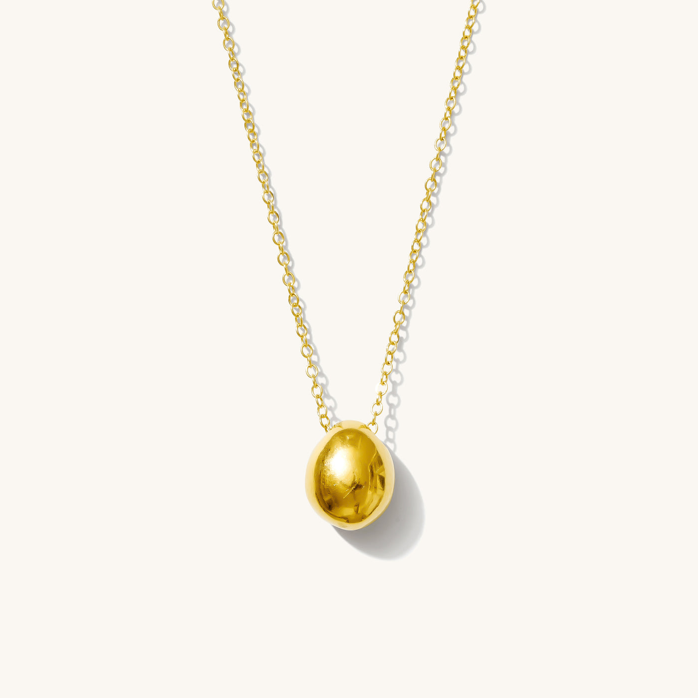 Gold Pebble Necklace on white background