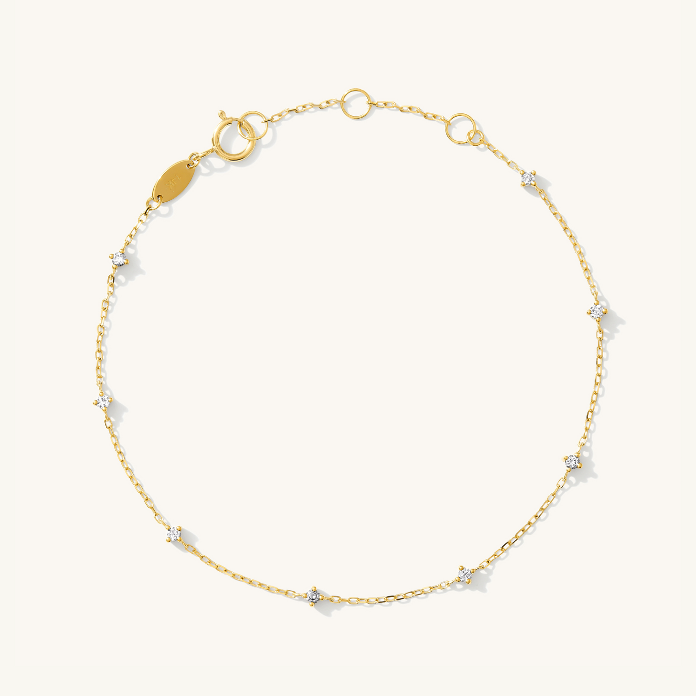 Gold bracelet with small diamonds on a white background: Dainty Diamond Station Bracelet - Reversible | Simple & Dainty Jewelry 